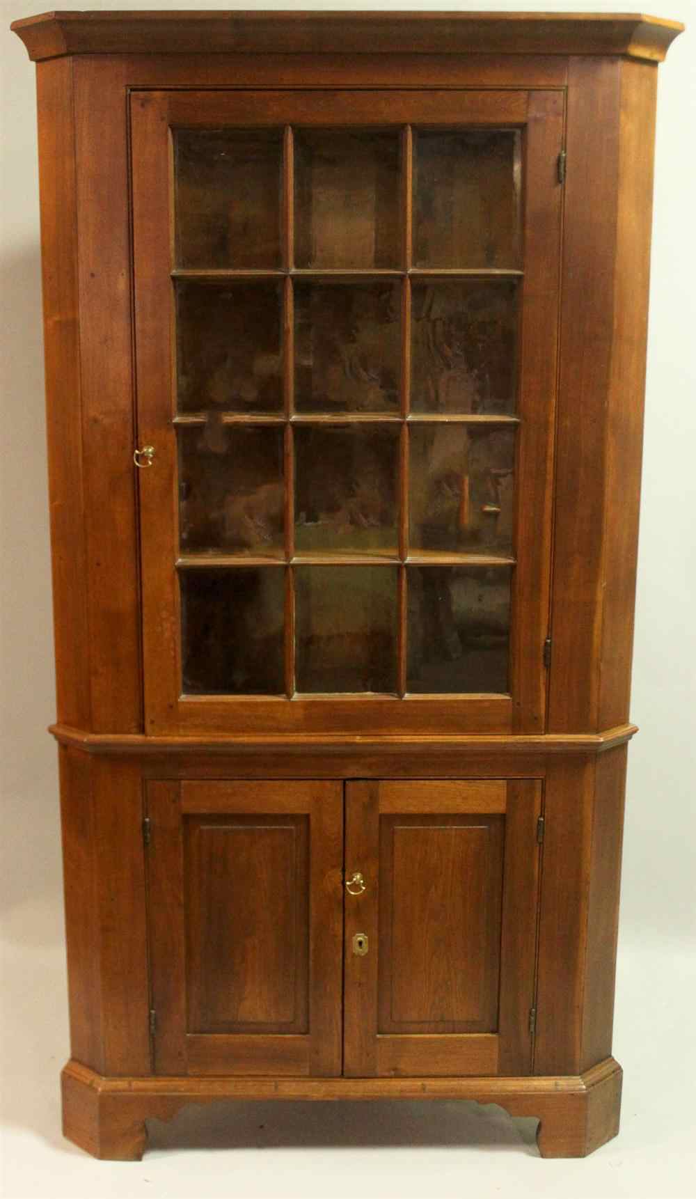 Appraisal: AMERICAN WALNUT CORNER CUPBOARD circa in one piece having a