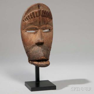 Appraisal: Dan Carved Wood Mask with Hinged Jaw with partial encrusted