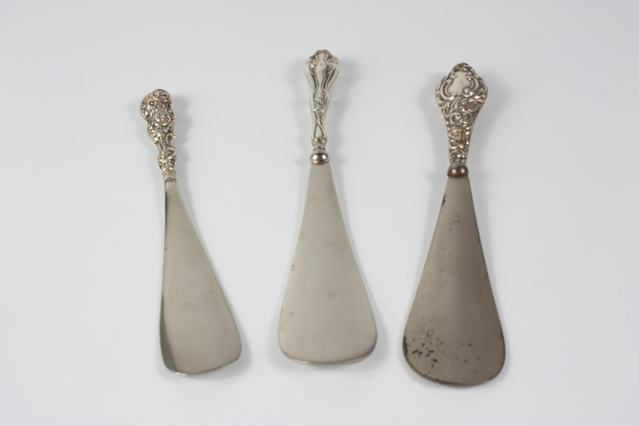 Appraisal: Three shoe horns two with silver handles and one marked