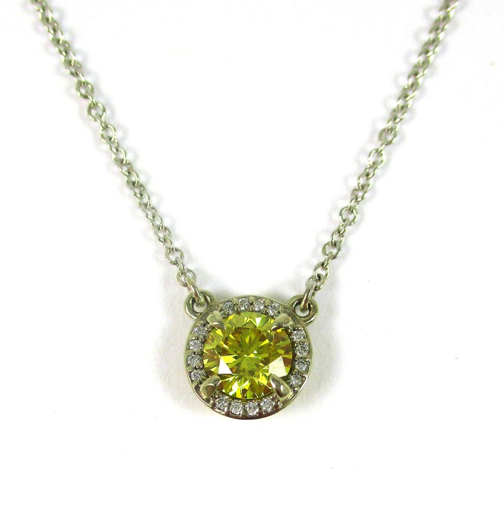 Appraisal: FANCY YELLOW DIAMOND AND WHITE GOLD PENDANT NECKLACE with a