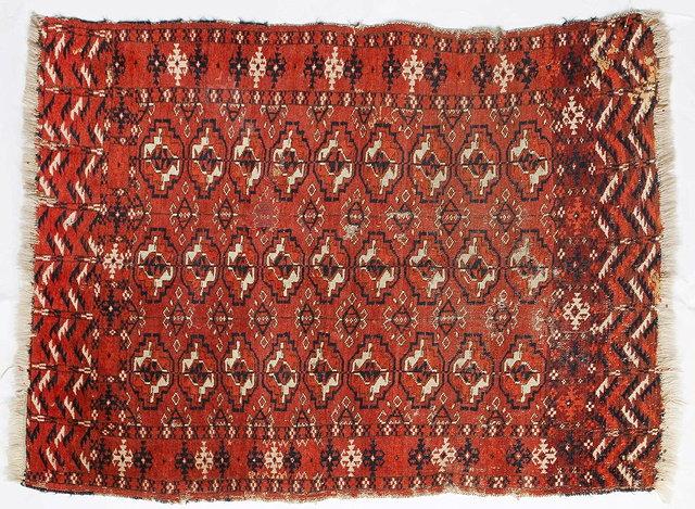 Appraisal: AN OLD TEKKE WEDDING RUG with three rows of medallions