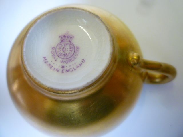 Appraisal: A ROYAL WORCESTER PORCELAIN MINIATURE CABINET CUP AND SAUCER dated