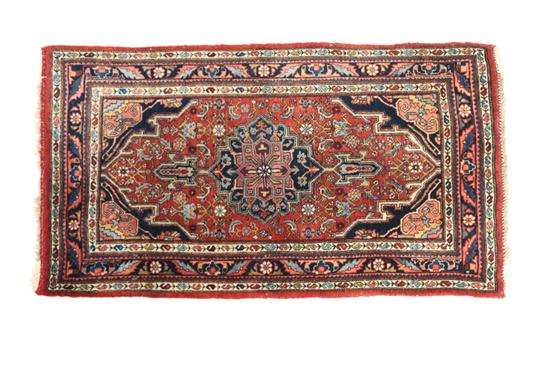 Appraisal: ORIENTAL RUG Twentieth century Bidjar Dark blue and pink medallion