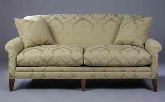 Appraisal: CONTEMPORARY ALL-UPHOLSTERED TWO-CUSHION SOFA Out-scrolled arms pair square accent pillows