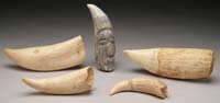 Appraisal: LOT OF FIVE WHALE S TEETH One tooth having carving