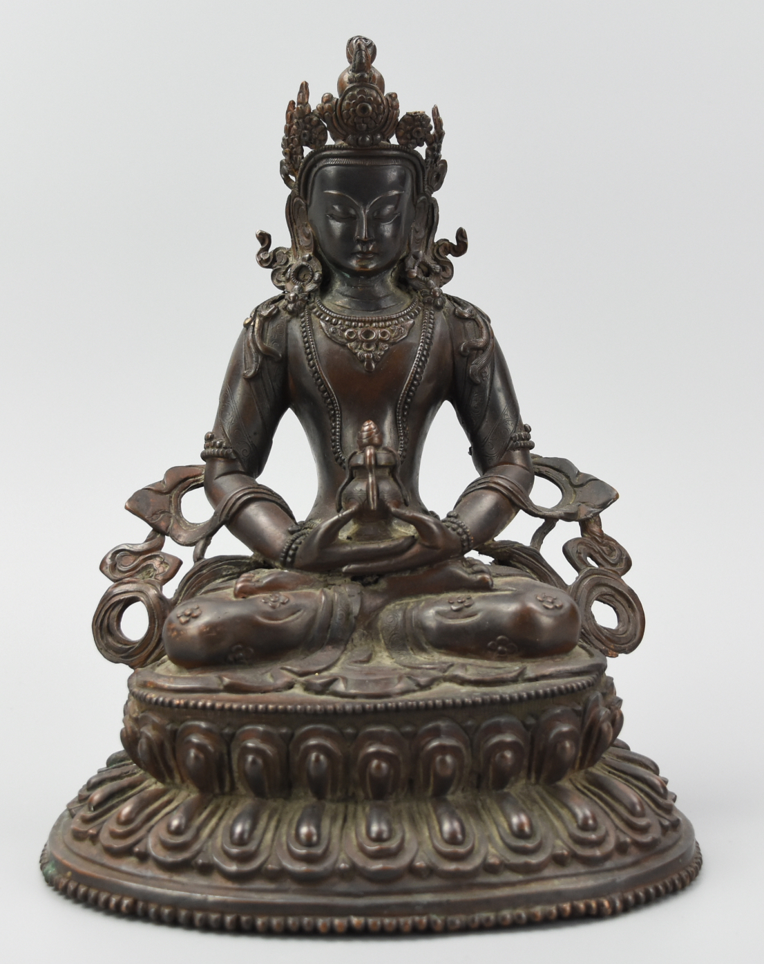 Appraisal: A SEATED BRONZE BUDDHA DOUBLE LOTUS W MEDICINE An authentic