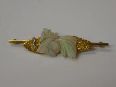 Appraisal: AN OPAL AND DIAMOND BROOCH the opal carved as a