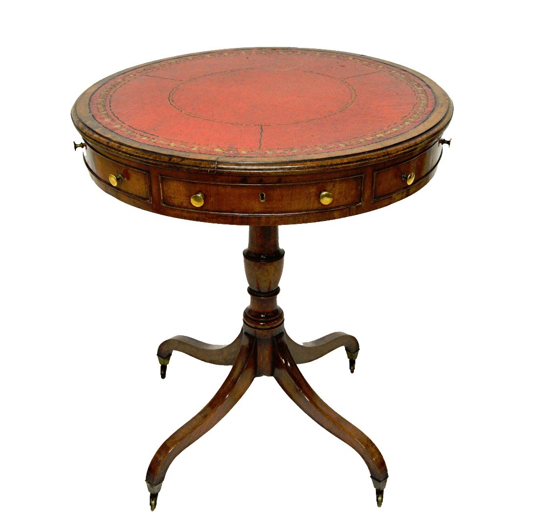 Appraisal: A George III mahogany drum table with gilt tooled rouge