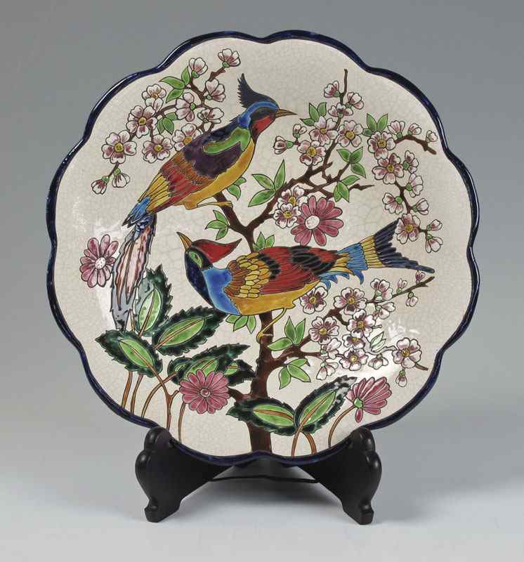 Appraisal: LONGWY FRENCH EARTHENWARE FOOTED BOWL Birds of Paradise on cherry