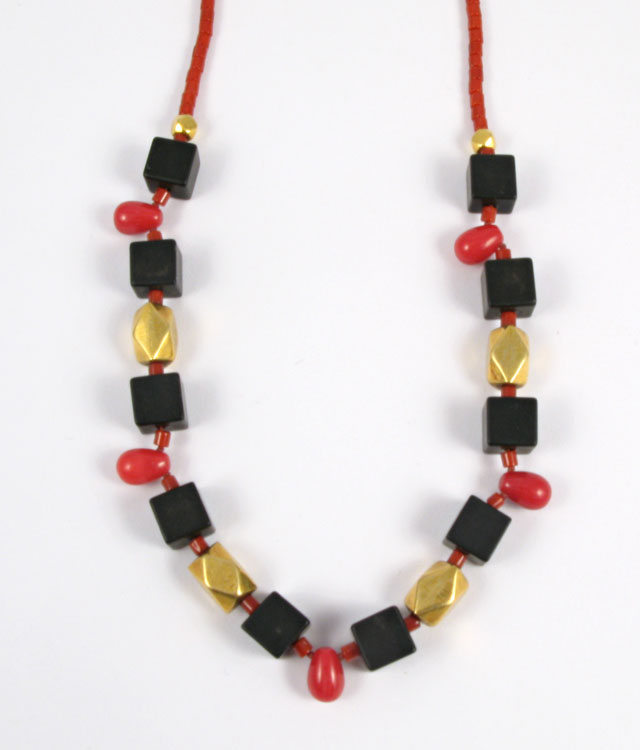 Appraisal: BLOOD CORAL AND BLACK ONYX NECKLACE in length and strung