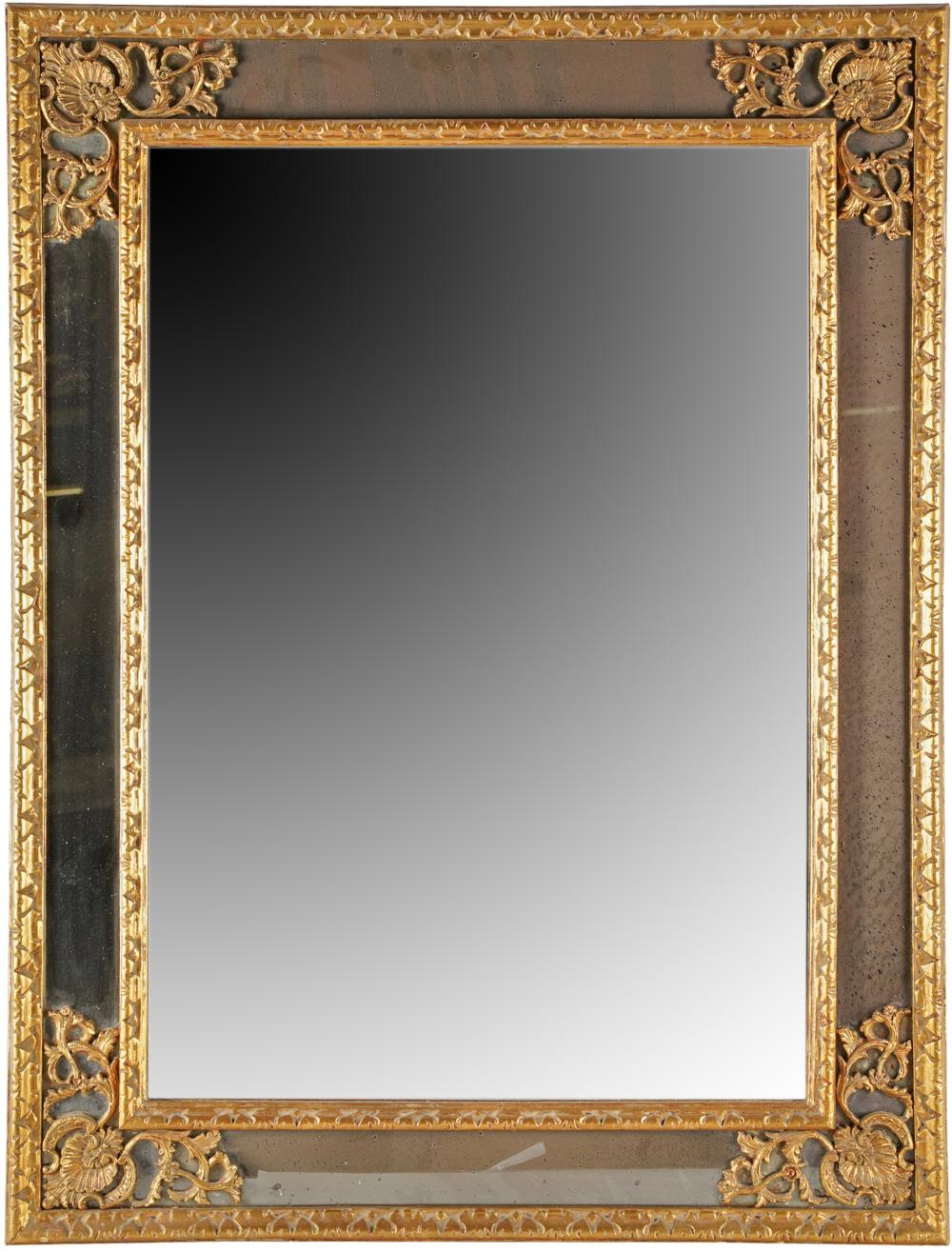 Appraisal: CARVED GILT WOOD WALL MIRRORwith flat central plate and marginal