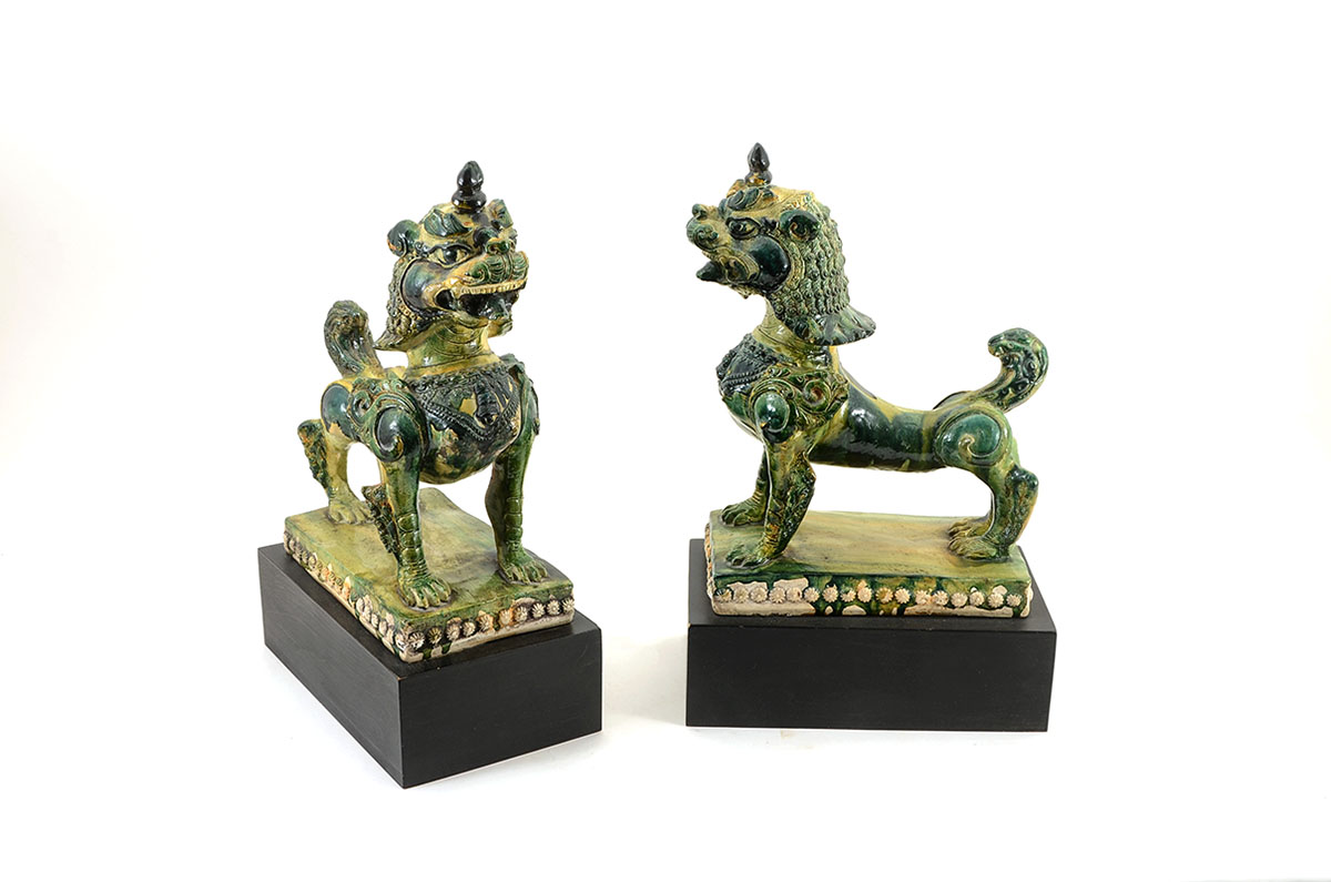 Appraisal: PAIR CHINESE GLAZED TEMPLE FOO LIONS Polychrome glazed in green