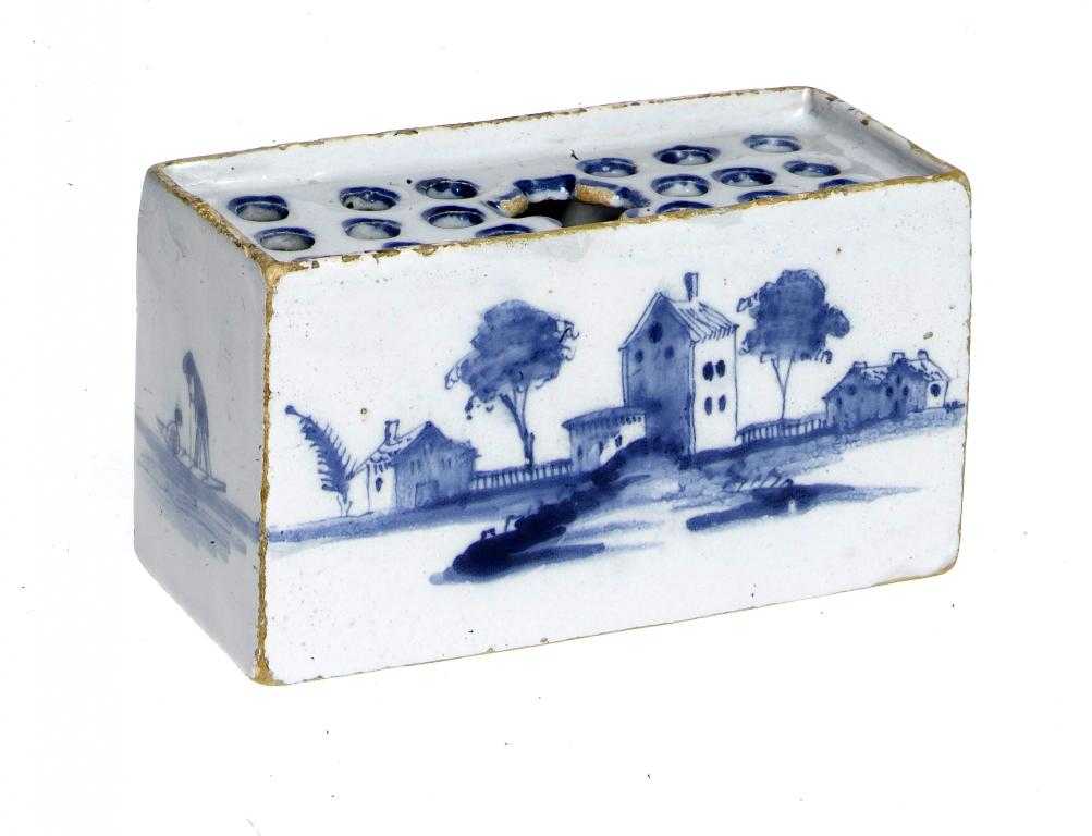 Appraisal: AN ENGLISH DELFTWARE FLOWER BRICK POSSIBLY LIVERPOOL painted in cobalt