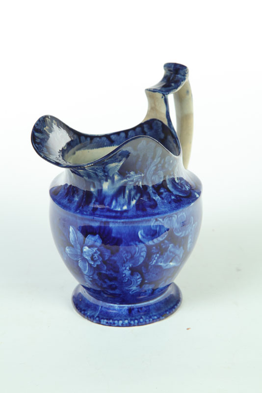 Appraisal: STAFFORDSHIRE WATER PITCHER England nd quarter- th century Dark blue