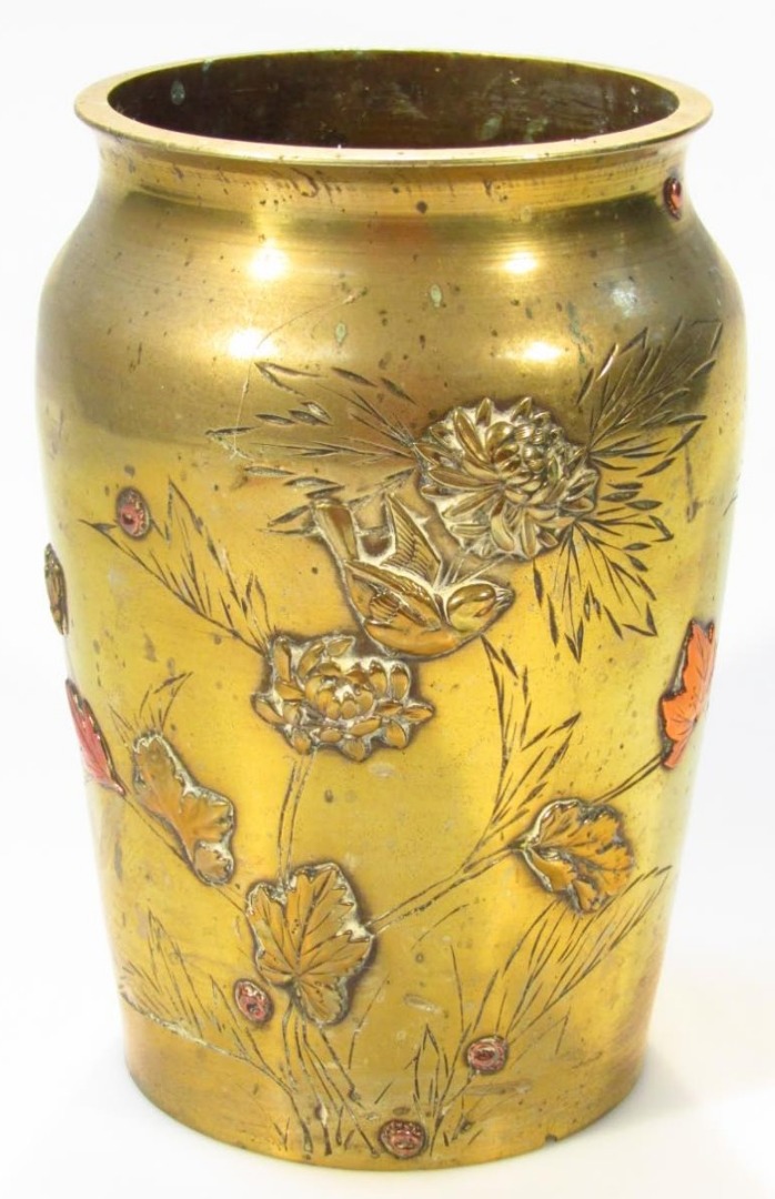 Appraisal: An oriental brass vase of circular shouldered outline raised with