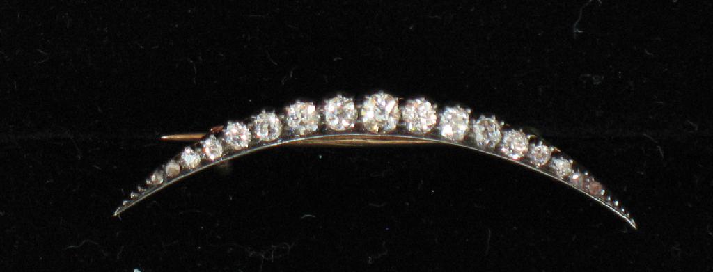 Appraisal: A DIAMOND CRESCENT BROOCH set overall with round old-cut diamonds