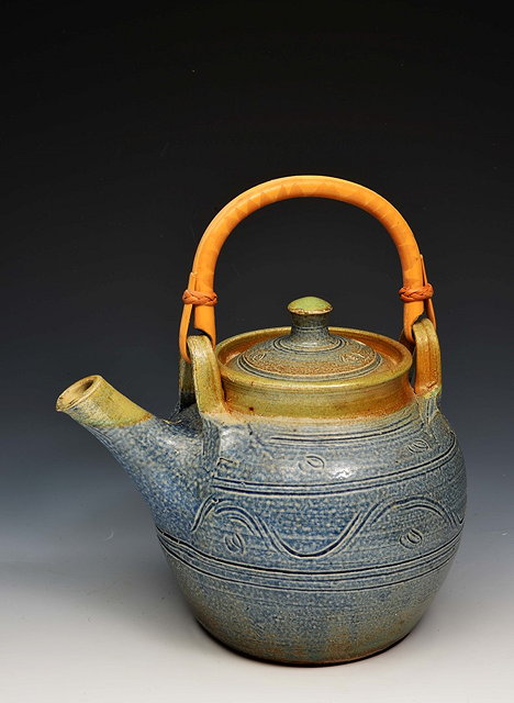 Appraisal: Ray Finch British - Teapot and cover incised wave decoration