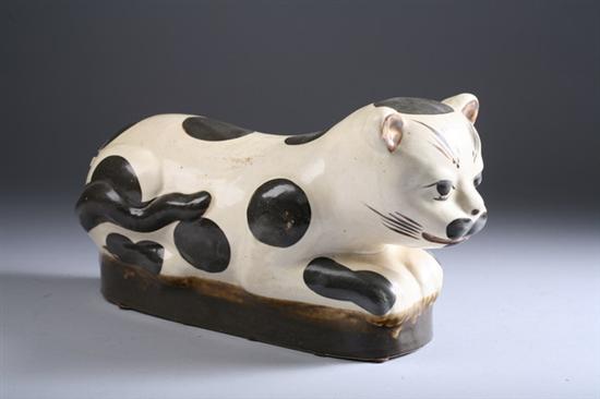 Appraisal: CHINESE CIZHOU STONEWARE CAT-FORM PILLOW With large dot decoration -