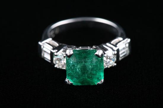 Appraisal: PLATINUM EMERALD AND DIAMOND RING ct emerald-cut emerald centered by