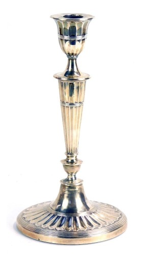 Appraisal: A Victorian silver candlestick of tapered form on oval weighted