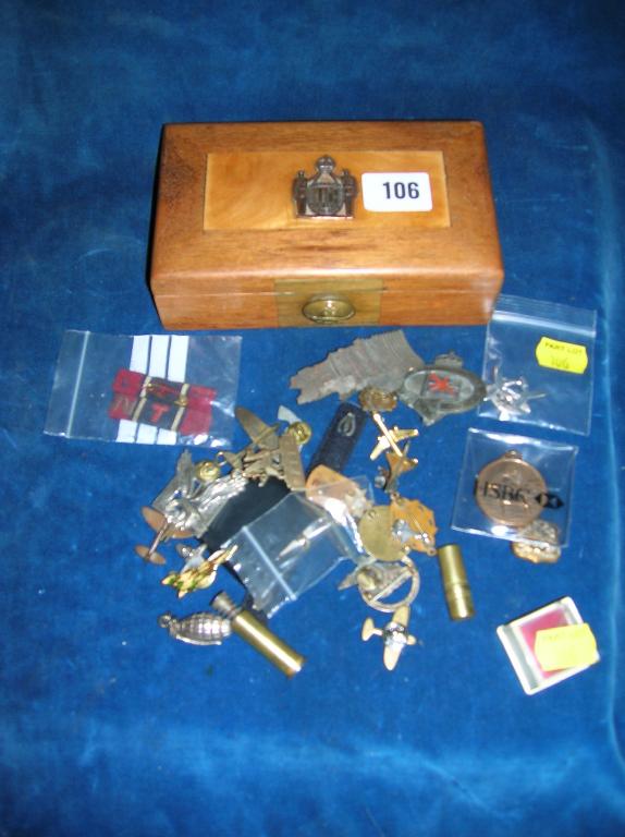 Appraisal: A small hardwood box containing a selection of badges and