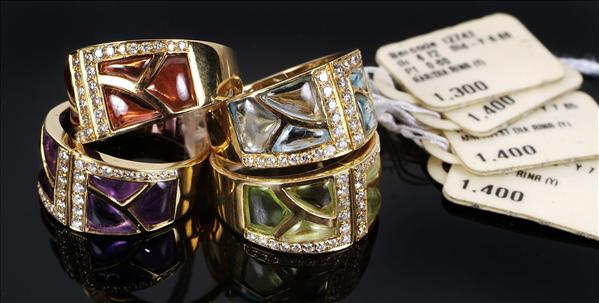 Appraisal: A matching set of four gem set rings each channel