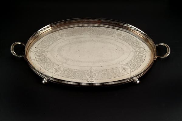 Appraisal: A silver oval galleried tray by Walker Hall Sheffield engraved