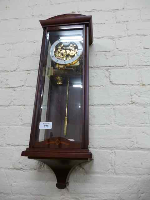 Appraisal: A THREE GLASS WALL CLOCK the dial with Roman numerals