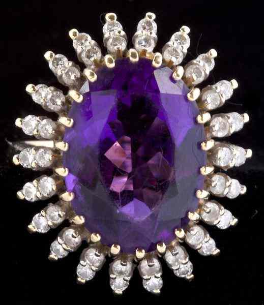 Appraisal: Gold and Amethyst Ringcentering on one oval cut amethyst carat