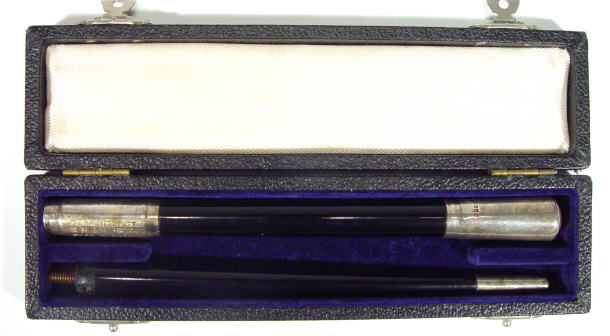 Appraisal: Silver collared black composite presentation baton in a case London