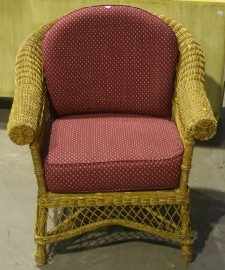 Appraisal: A caned armchair with red fabric upholstered cushion