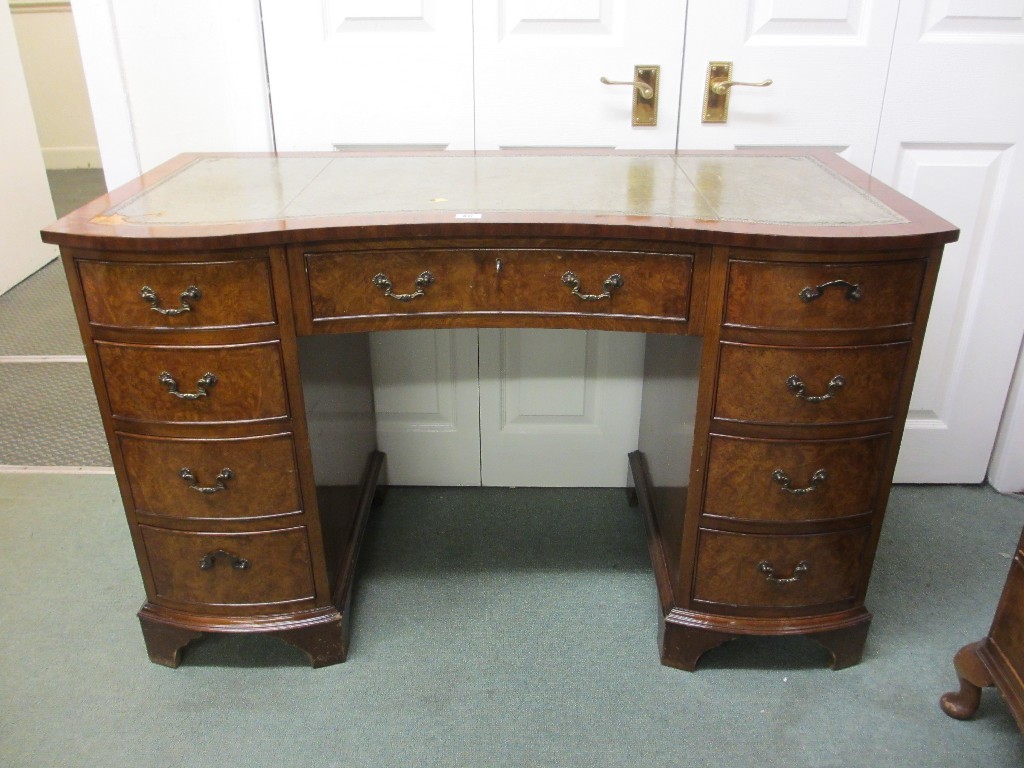 Appraisal: Walnut kneehole desk with leather tooled top