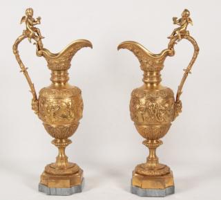 Appraisal: PAIR OF FRENCH DORE BRONZE PUTTI MOUNTED EWERS PAIR OF