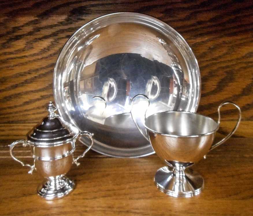 Appraisal: THREE STERLING SILVER HOLLOWWARE ITEMS a footed bowl having low