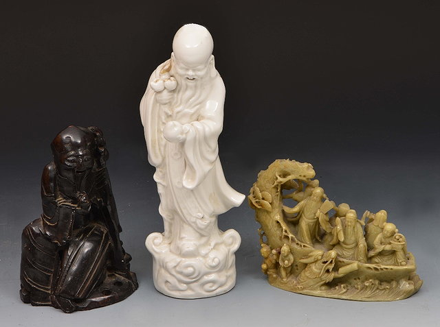 Appraisal: Chinese carved soapstone figureShou Lao one other Chinese soapstone group