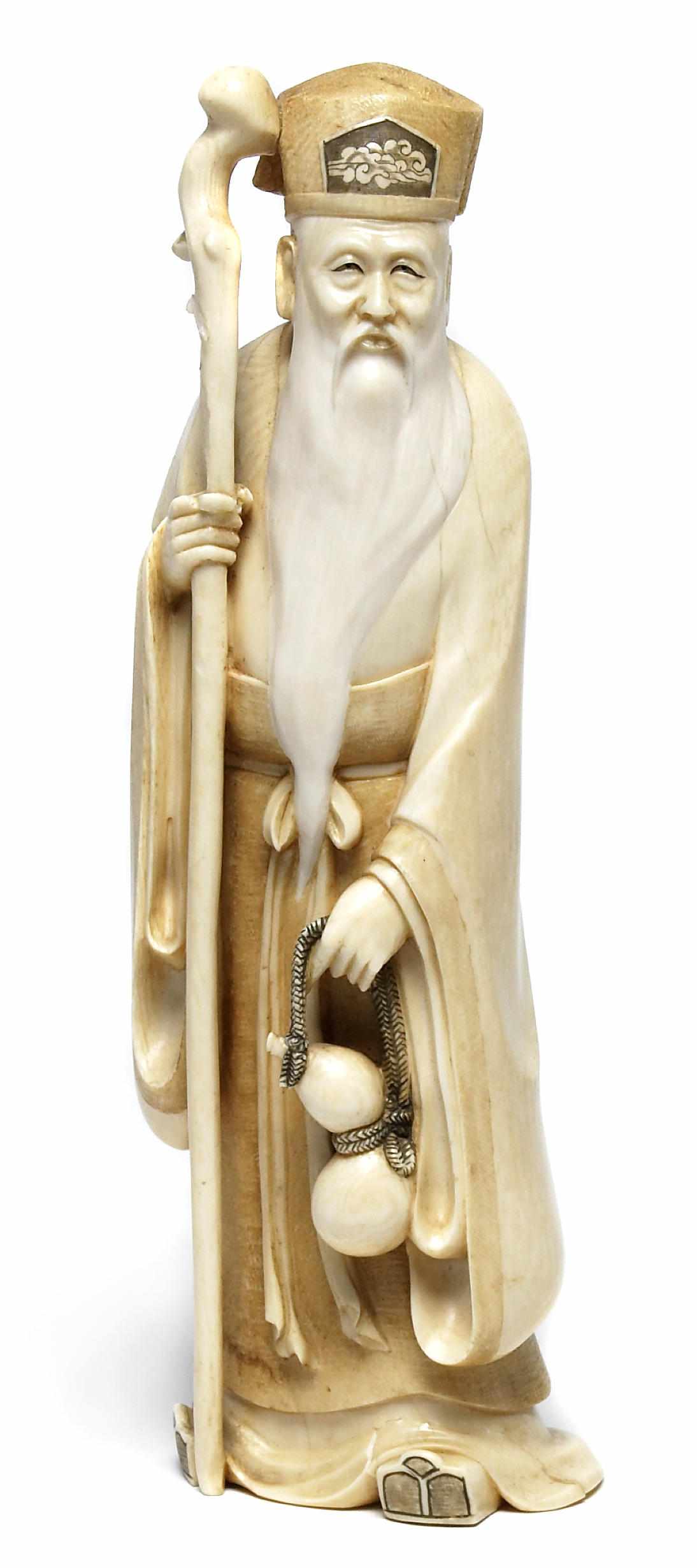 Appraisal: A Japanese ivory okimono Meiji periodDepicting an Immortal holding a