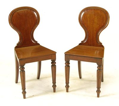 Appraisal: A pair of Victorian mahogany hall chairs