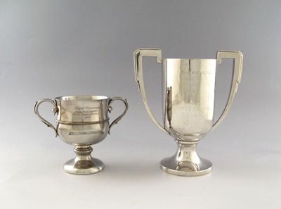 Appraisal: An Edwardian silver two-handled trophy cup circular form scroll handles