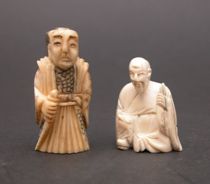 Appraisal: Japanese Netsukes Two small hand carved ivory netsukes The first