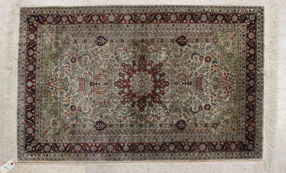 Appraisal: HAND KNOTTED SILK AREA RUG Indo-Persian floral and central floral