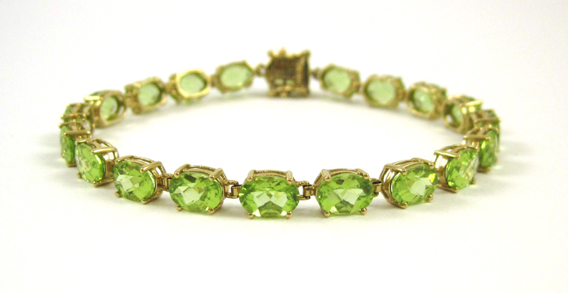 Appraisal: PERIDOT AND TEN KARAT YELLOW GOLD BRACELET measuring - inches