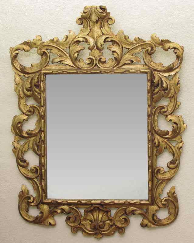 Appraisal: CARVED AND GILT WOOD FRAMED MIRROR Ornate foliate scroll shell