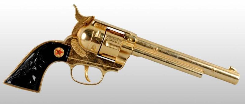 Appraisal: Hubley Cowboy Gold-Plated Toy Cap Gun Description Gun Unfired Gold