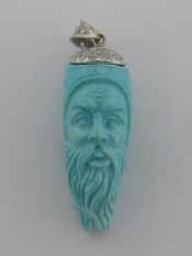 Appraisal: An carat white gold diamond and carved turquoise pendant the