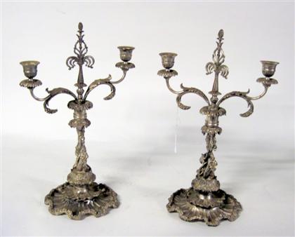 Appraisal: Pair of Continental silvered bronze candelabraEach with a berried finial