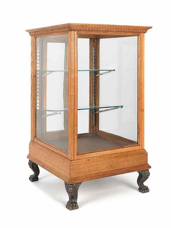 Appraisal: Oak country store display cabinet ca with ball and claw