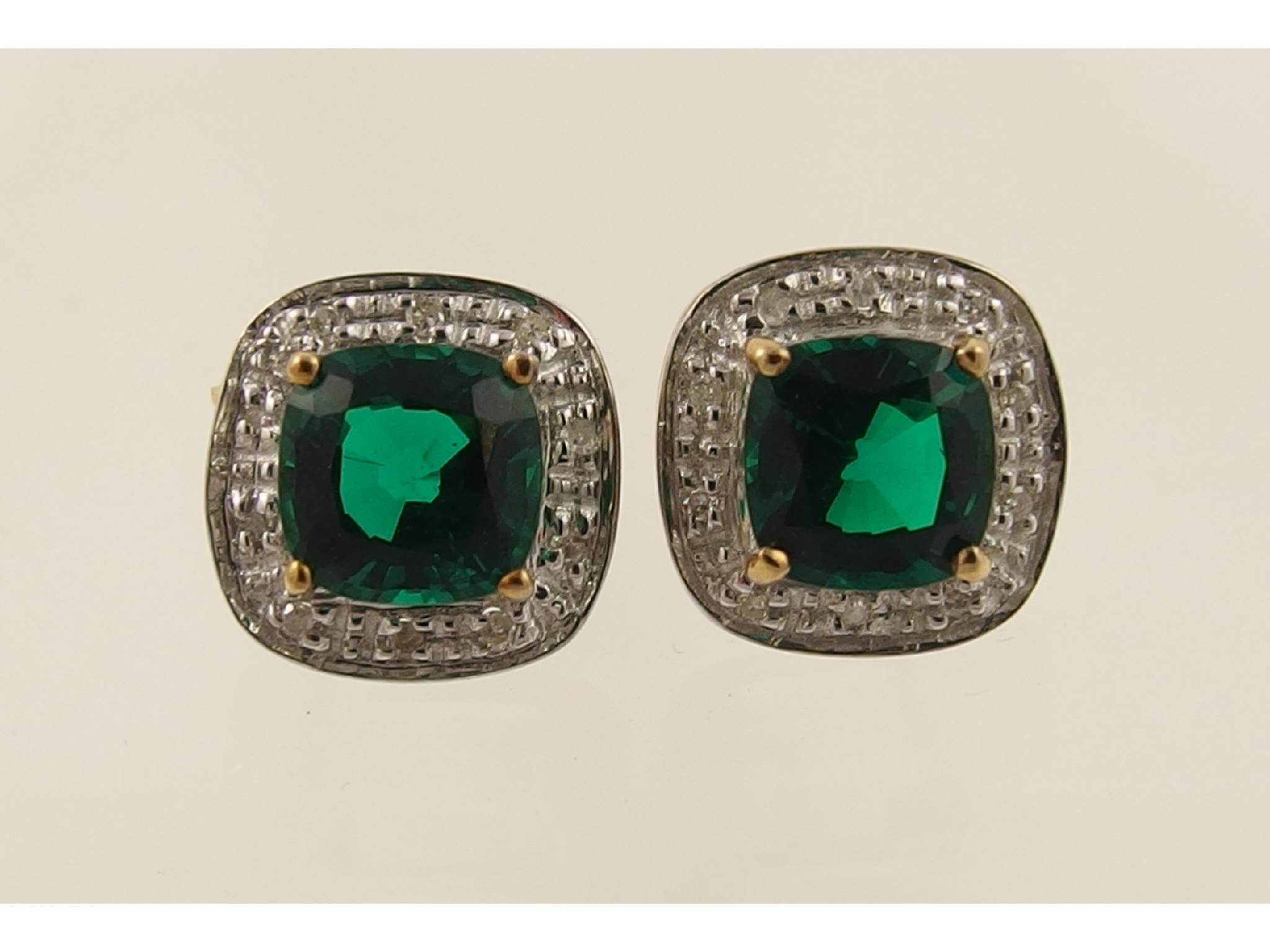 Appraisal: A pair of ct simulated emerald and diamond earrings