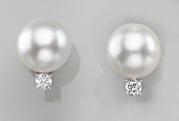 Appraisal: each earring featuring a South Sea cultured pearl measuring approximately