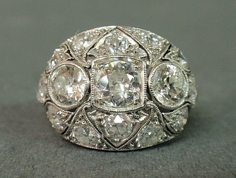 Appraisal: Art Deco platinum and diamond ring with a filigree basket