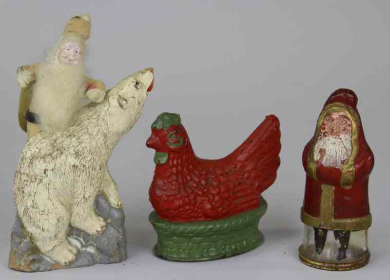 Appraisal: LOT OF THREE CANDY CONTAINERS Includes composition Santa polar bear